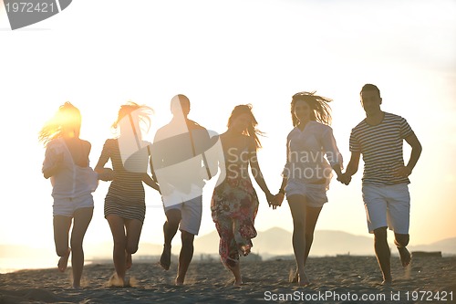 Image of happy young  people group have fun on beach