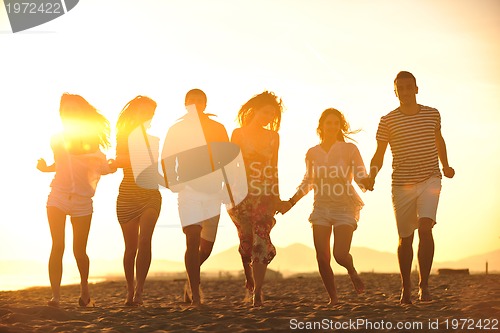 Image of happy young  people group have fun on beach