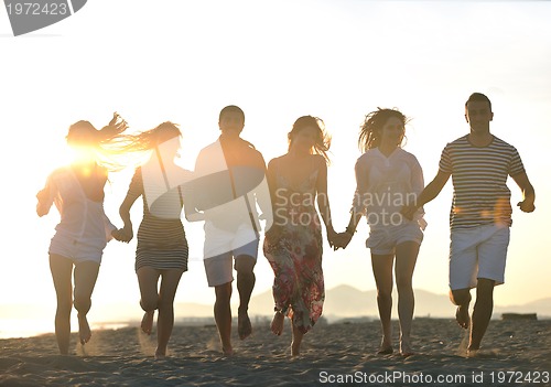 Image of happy young  people group have fun on beach