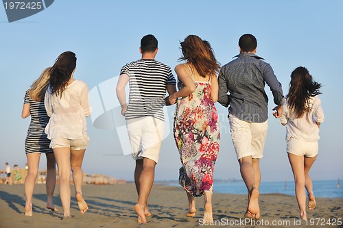 Image of happy young  people group have fun on beach