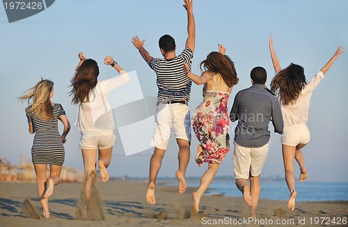 Image of happy young  people group have fun on beach