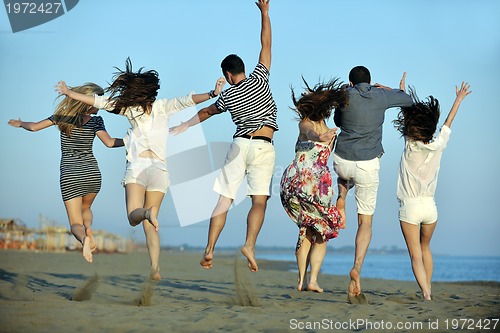 Image of happy young  people group have fun on beach