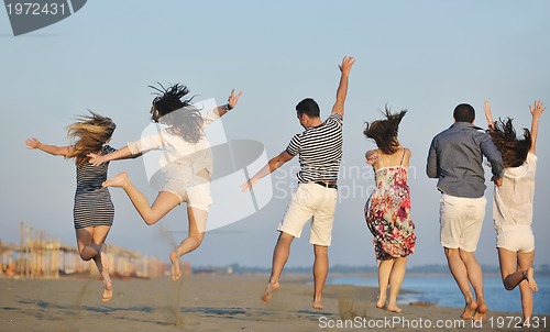 Image of happy young  people group have fun on beach