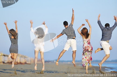 Image of happy young  people group have fun on beach