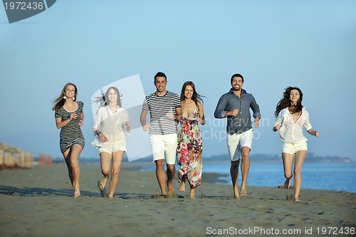 Image of happy young  people group have fun on beach