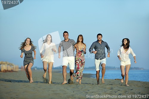 Image of happy young  people group have fun on beach