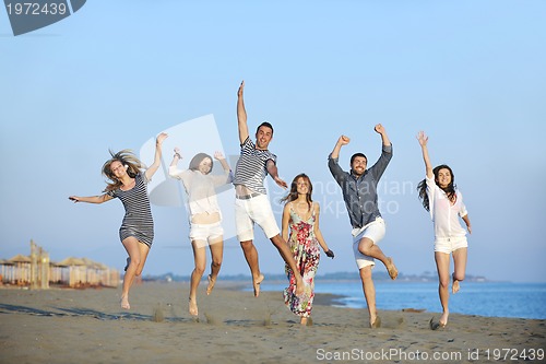 Image of happy young  people group have fun on beach