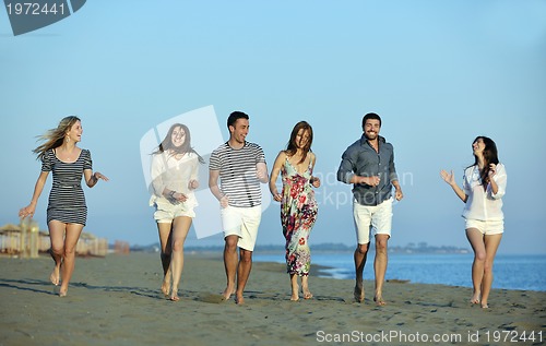 Image of happy young  people group have fun on beach