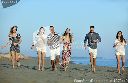 Image of happy young  people group have fun on beach