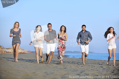 Image of happy young  people group have fun on beach