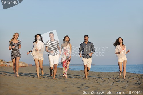 Image of happy young  people group have fun on beach