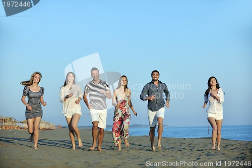 Image of happy young  people group have fun on beach