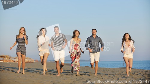 Image of happy young  people group have fun on beach
