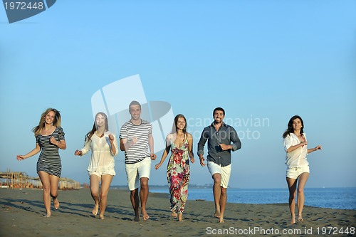 Image of happy young  people group have fun on beach