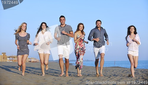 Image of happy young  people group have fun on beach