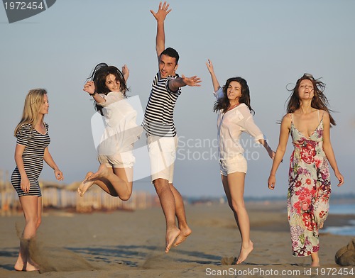 Image of happy young  people group have fun on beach