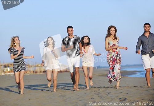 Image of happy young  people group have fun on beach