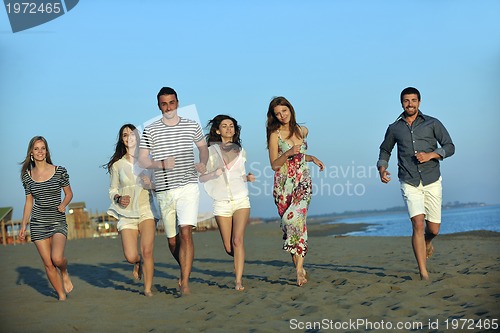 Image of happy young  people group have fun on beach