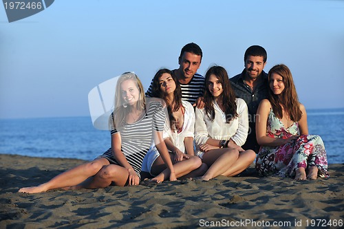 Image of happy young  people group have fun on beach