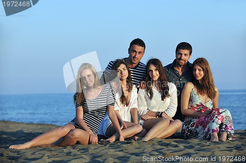 Image of happy young  people group have fun on beach