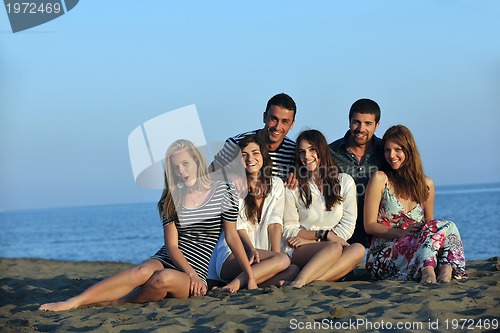 Image of happy young  people group have fun on beach