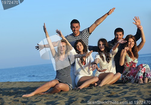 Image of happy young  people group have fun on beach