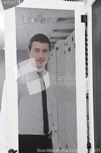 Image of young it engeneer in datacenter server room