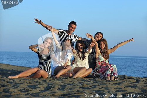 Image of happy young  people group have fun on beach