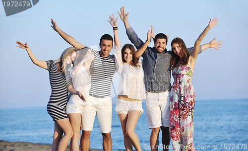 Image of happy young  people group have fun on beach