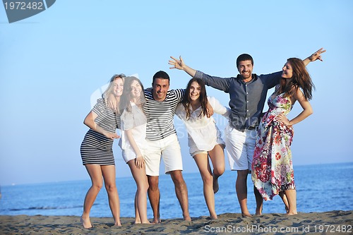 Image of happy young  people group have fun on beach