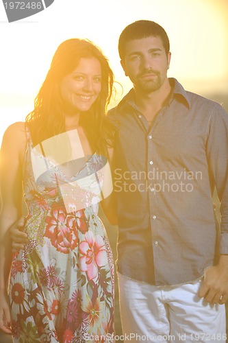 Image of happy young couple have romantic time on beach
