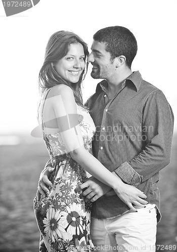 Image of happy young couple have romantic time on beach