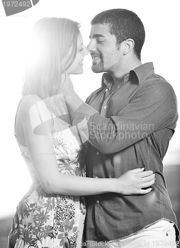 Image of happy young couple have romantic time on beach