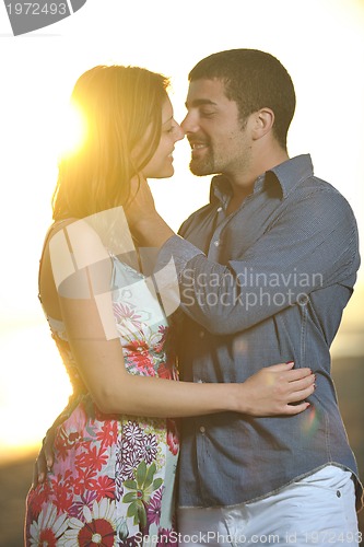 Image of happy young couple have romantic time on beach
