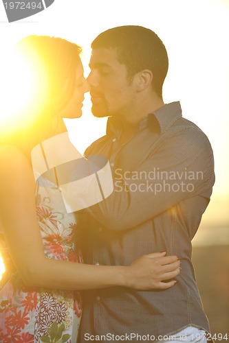 Image of happy young couple have romantic time on beach
