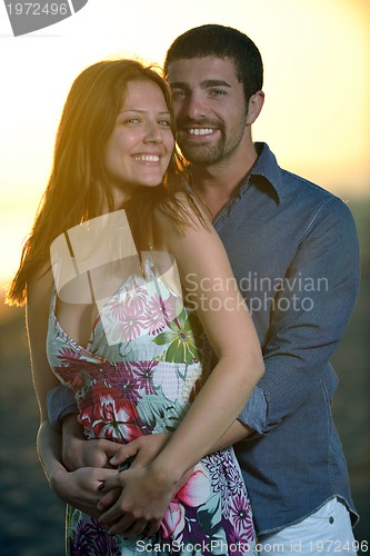 Image of happy young couple have fun on beach