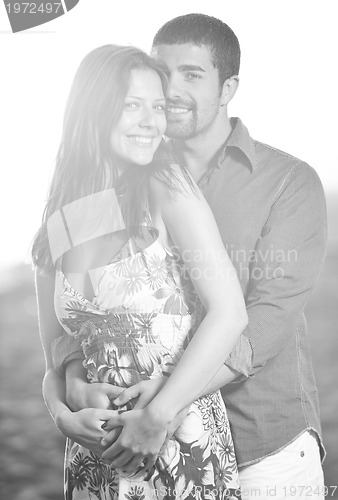 Image of happy young couple have romantic time on beach