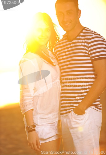 Image of happy young couple have romantic time on beach