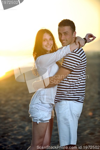 Image of happy young couple have fun on beach