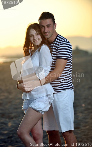 Image of happy young couple have fun on beach