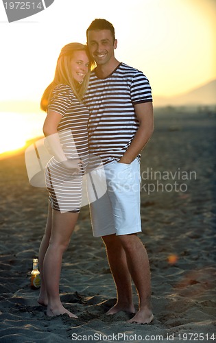 Image of happy young couple have fun on beach
