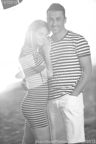 Image of happy young couple have romantic time on beach