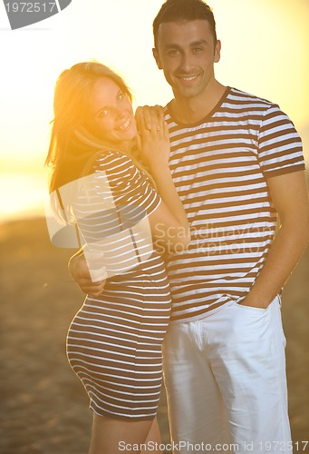 Image of happy young couple have romantic time on beach