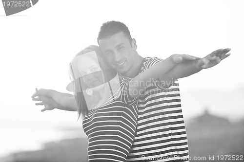 Image of happy young couple have romantic time on beach