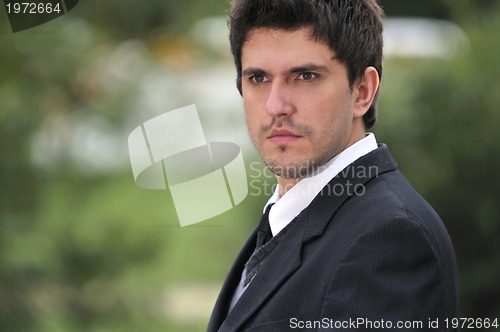 Image of one young businessman face portrait outdoor