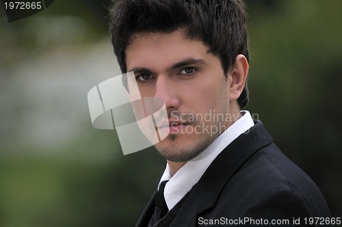 Image of one young businessman face portrait outdoor