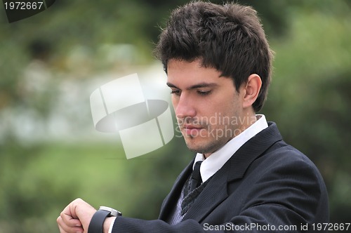 Image of one young businessman face portrait outdoor