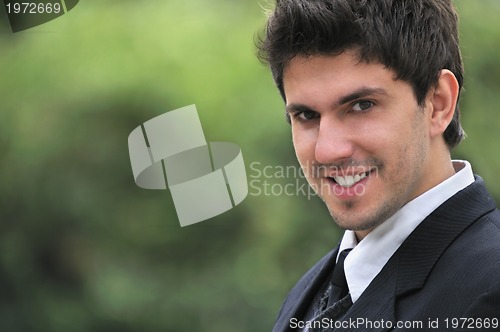 Image of one young businessman face portrait outdoor