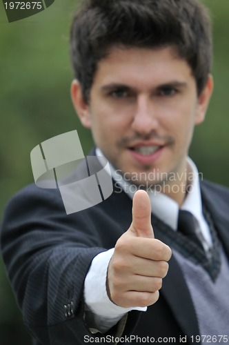 Image of Young caucasian business man in a suite, pointing at camera to y