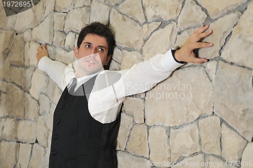 Image of Indoor portrait of young and happy  businessman
